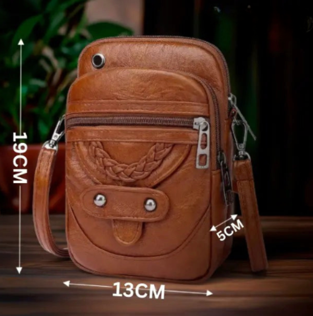 Eleganza senza tempo e borsa a tracolla chic di Vellana