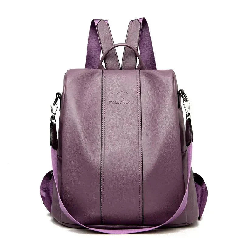 A stylish women's backpack with a sleek design, featuring a sturdy handle, adjustable shoulder straps, and side hooks for versatile carrying options. The bag has a smooth finish and a spacious main compartment, ideal for everyday use or travel.