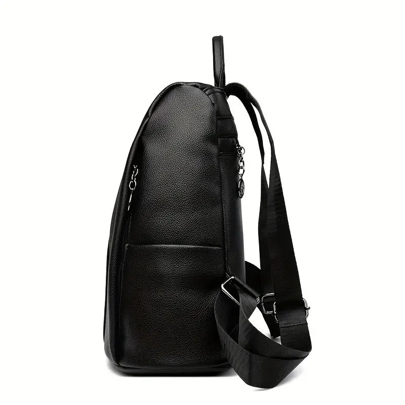 A stylish women's backpack with a sleek design, featuring a sturdy handle, adjustable shoulder straps, and side hooks for versatile carrying options. The bag has a smooth finish and a spacious main compartment, ideal for everyday use or travel.