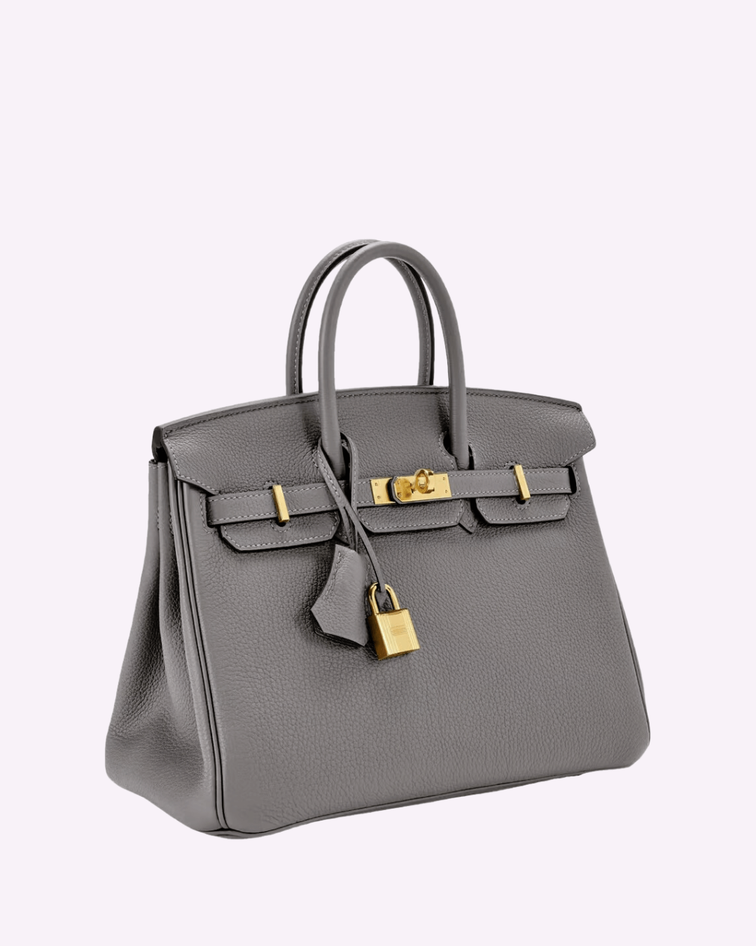 Image showing a woman holding an elegant handbag with a sleek design, featuring gold hardware and a structured shape, paired with casual attire for a stylish, sophisticated look.