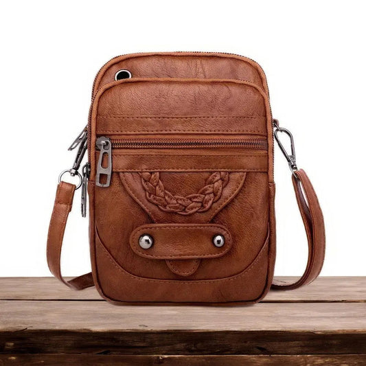 Eleganza senza tempo e borsa a tracolla chic di Vellana