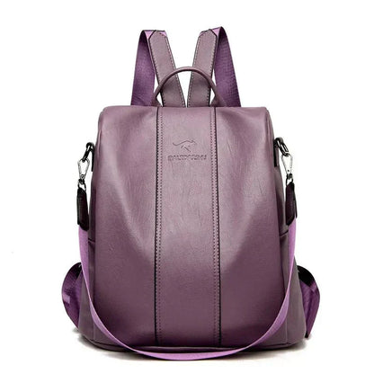  A stylish women's backpack with a sleek design, featuring a sturdy handle, adjustable shoulder straps, and side hooks for versatile carrying options. The bag has a smooth finish and a spacious main compartment, ideal for everyday use or travel.